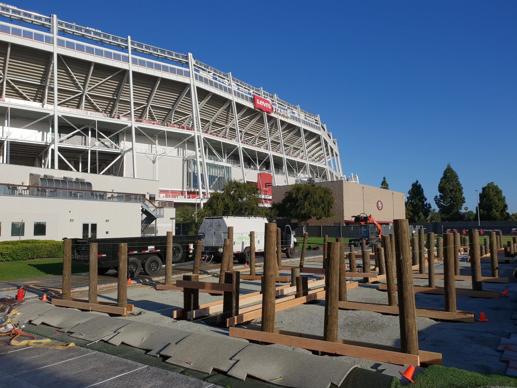 Posts and log cross-beams assembled with Levi's Stadium clearly visible in the background