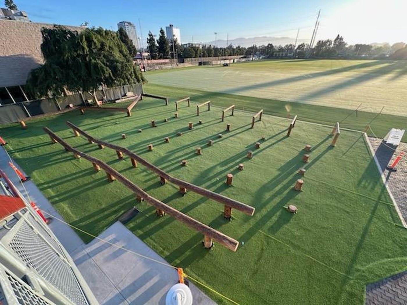 Overhead view of the completed relocated 49ers obstacle course with the Santa Clara skyline behind